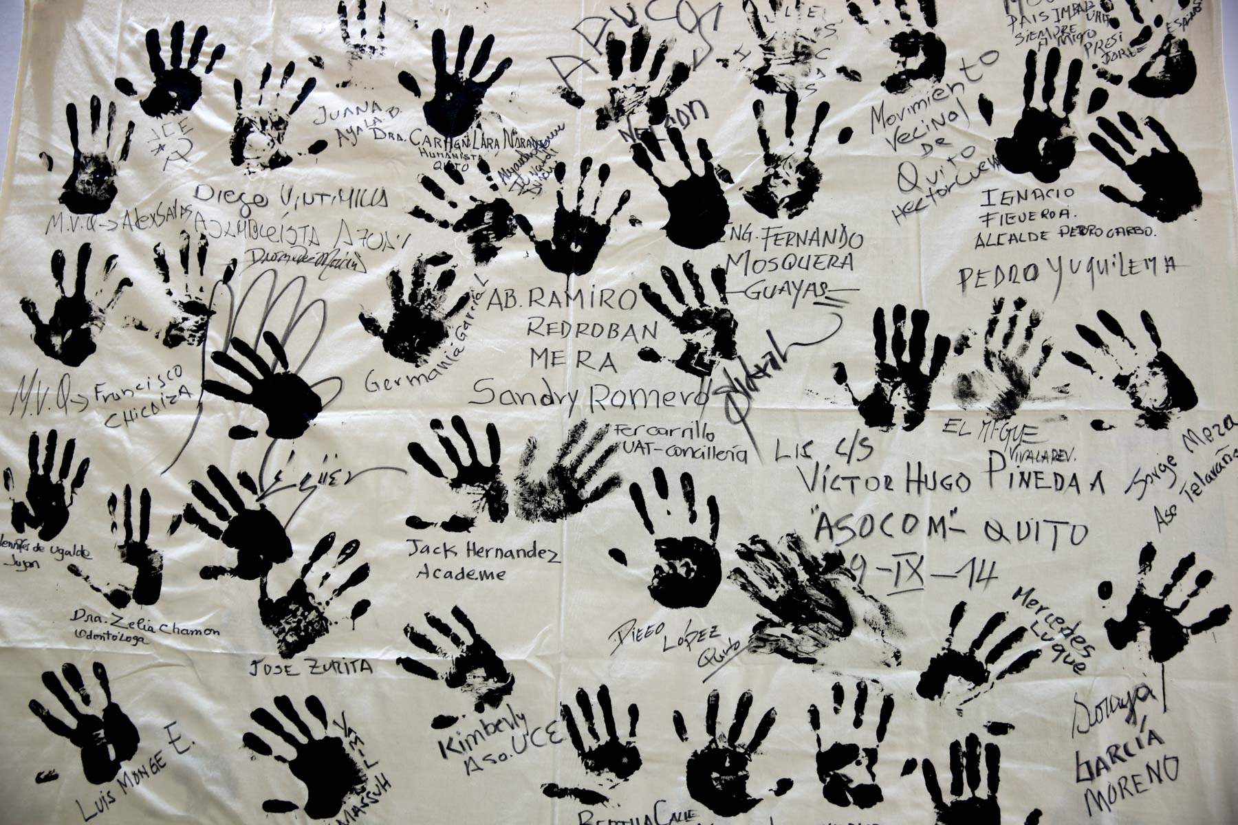 COP21, Paris, 2015. Handprints on a banner symbolise people’s commitment to climate action.