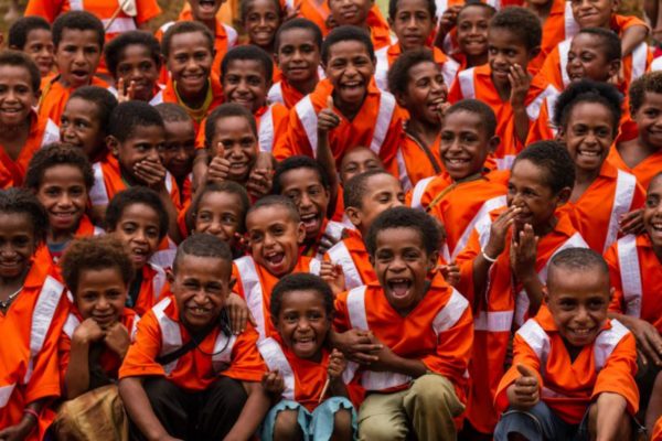 Porohali, Hela Province, 2014. Since the construction of a road throughout the Hides region, road safety has become a primary concern for local villages. High visibility safety vests have since become a standard uniform throughout the area.