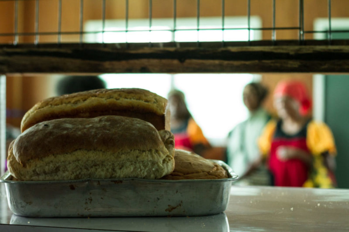 Komo, Hela Province, 2014. In an effort to encourage local economies, baking training was conducted with women’s groups across the area. Using drum ovens, the initiative has been incredibly successful and this baking group in Komo eventually built their own bakery to supply their growing demand.