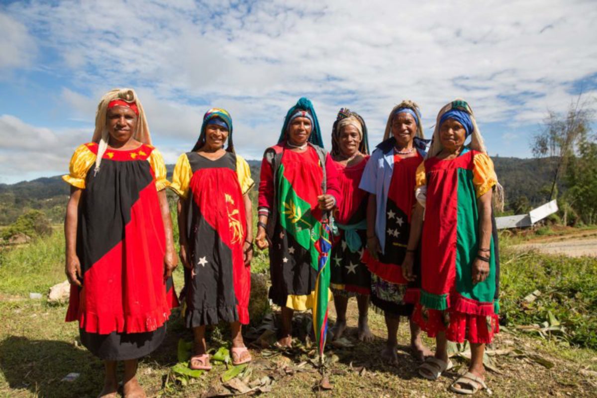 Hides, 2018. A group of women stand on a mountain top, sharing stories of how they have they have worked with women across the area to improve agricultural production.