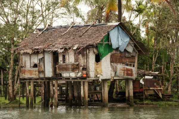 Kikori River, Gulf Province, 2012. A typical stilted hut along the banks of the Kikori river.