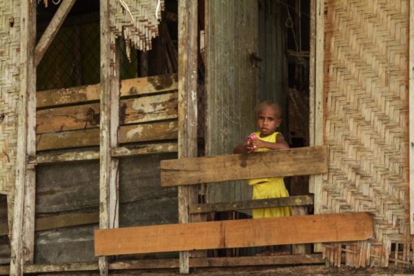 Kikori River, Gulf Province, 2012. A young girl peers out of the door of her stilted hut.
Hides, Hela Province, 2012. Drum ovens, fueled by wood collected from the forest, are a common way of preparing food in the village.