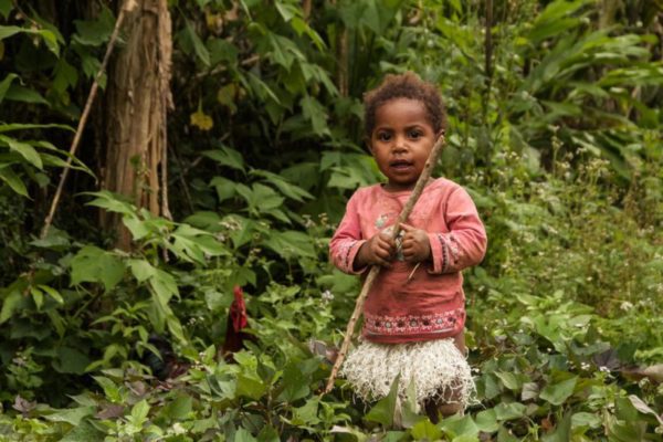 Hides, Hela Province, 2012. A young girl plays in the garden.