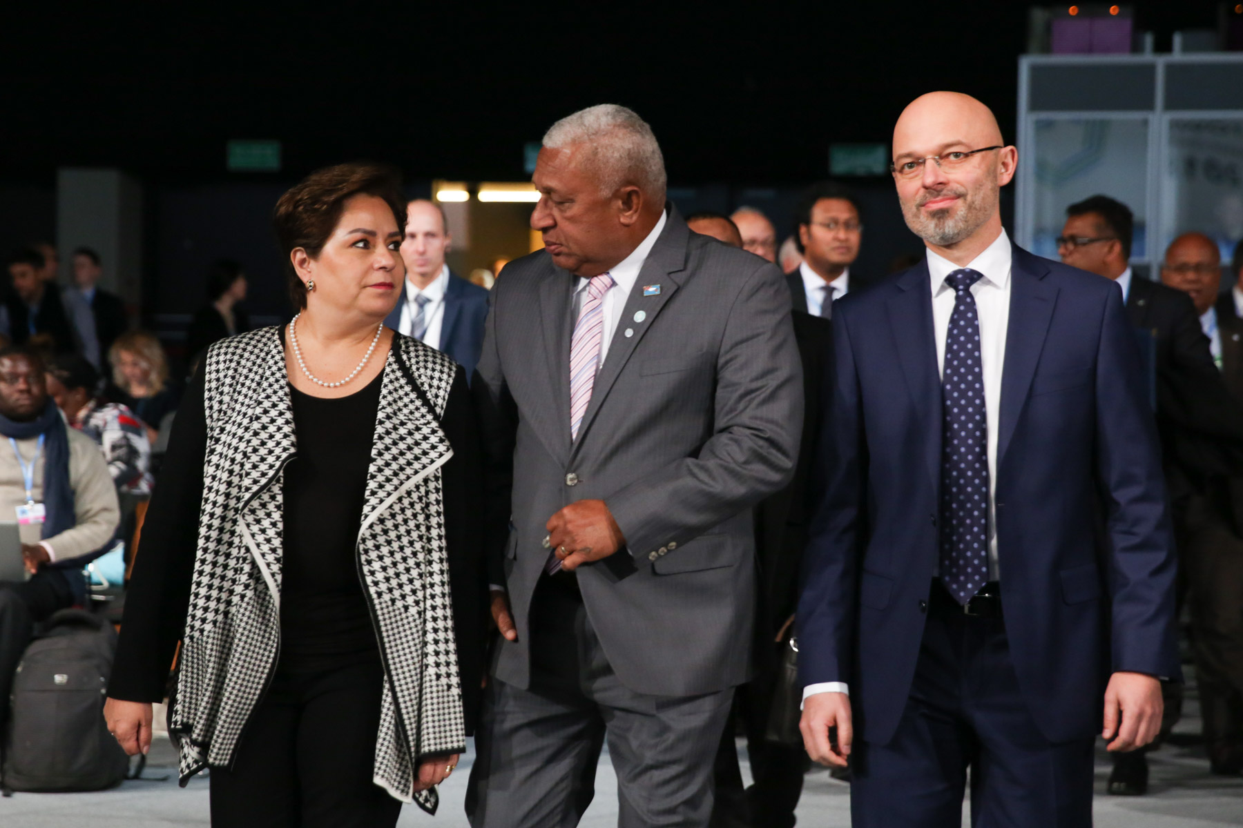 COP24, Katowice, 2018. UNFCCC Executive Secretary Patricia Espinosa, Frank Bainimarama, COP 23 President, and Michał Kurtyka, COP 24 President, arrive in plenary.